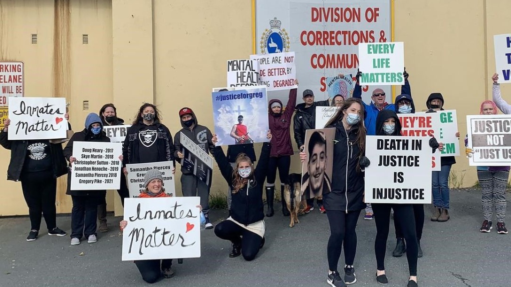 A few dozen people gathered outside Her Majesty's Penitentiary jail to demand better mental health care for inmates in Newfoundland and Labrador, in St. John's, Saturday, Oct. 9, 2021.  SARAH SMELLIE / THE CANADIAN PRESS