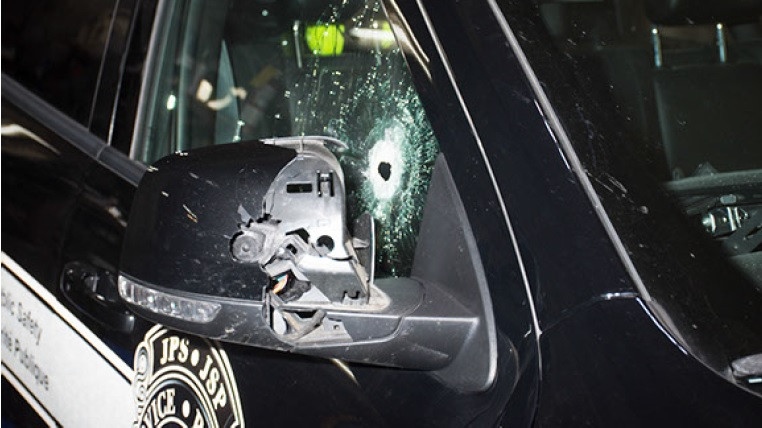 A suspect shot at the peace officers' vehicle, striking the passenger side window and the driver's headrest. One peace officer suffered minor injuries. (COURTESY: N.B. RCMP)