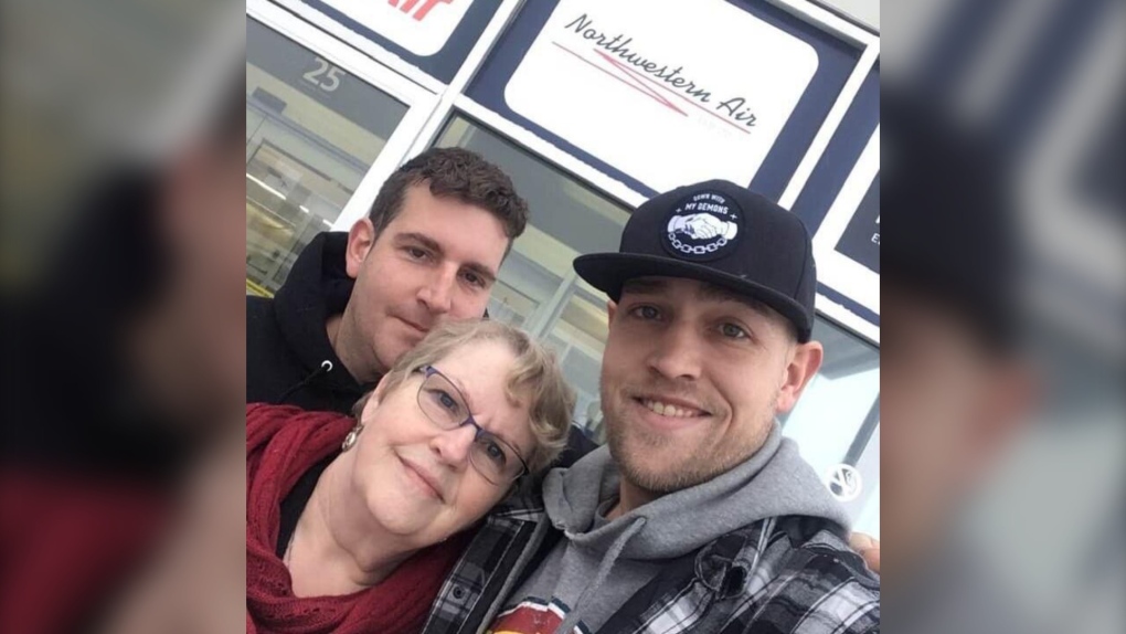 Mary MacDonald, centre, poses with her sons Luke Anthony Landry, right, and Julian Landry in this undated handout photo. MacDonald says a series of systemic failures led to the death of her son Luke in Moncton last week. THE CANADIAN PRESS/HO