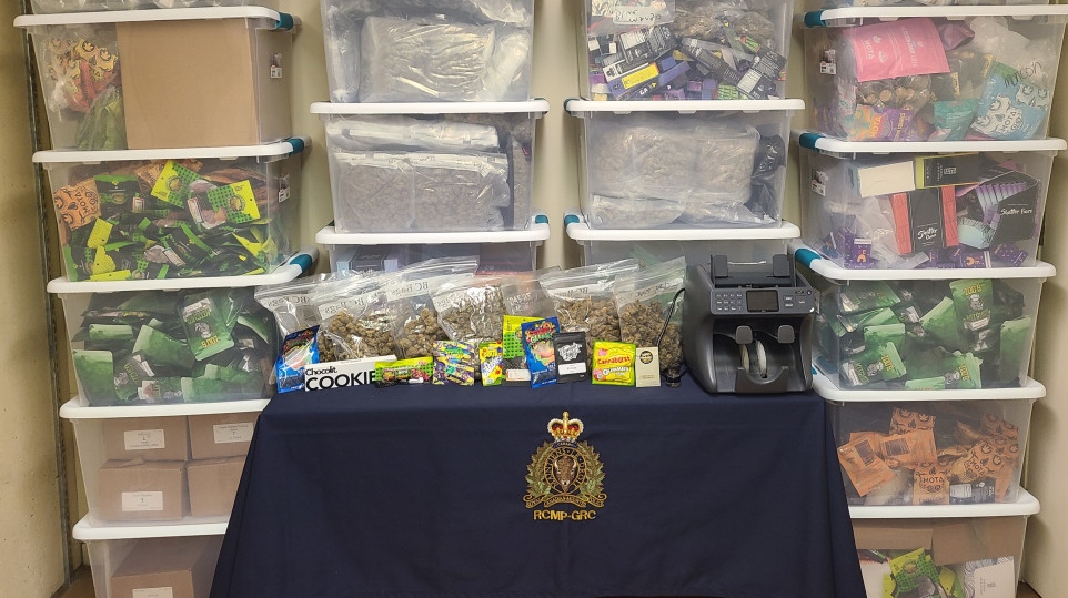 Officers seized large quantities of cannabis, electronic devices, and nearly $115,000 in cash. (PHOTO: RCMP)