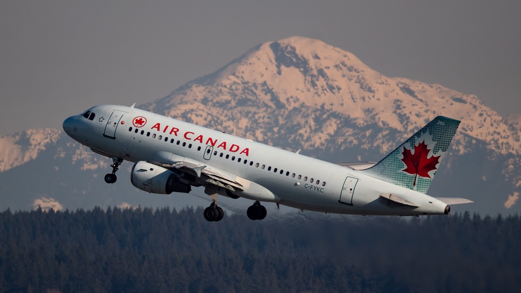 An Air Canada flight departing for Calgary takes off at Vancouver International Airport, in Richmond, B.C., on Friday, March 20, 2020. THE CANADIAN PRESS/Darryl Dyck 