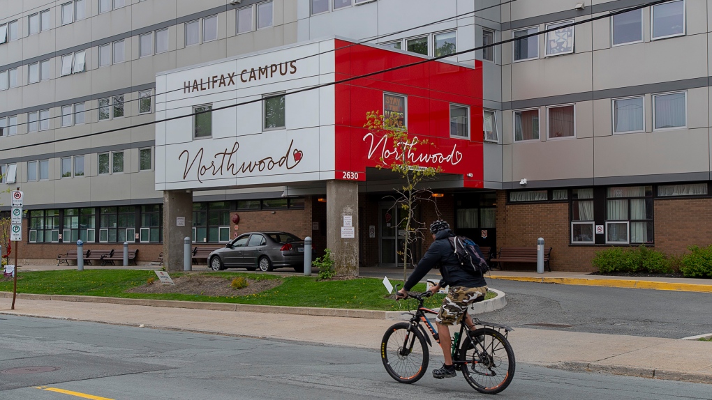 A cyclist heads past Northwood Manor, one of the largest nursing homes in Atlantic Canada, in Halifax on Tuesday, June 2, 2020. THE CANADIAN PRESS/Andrew Vaughan 