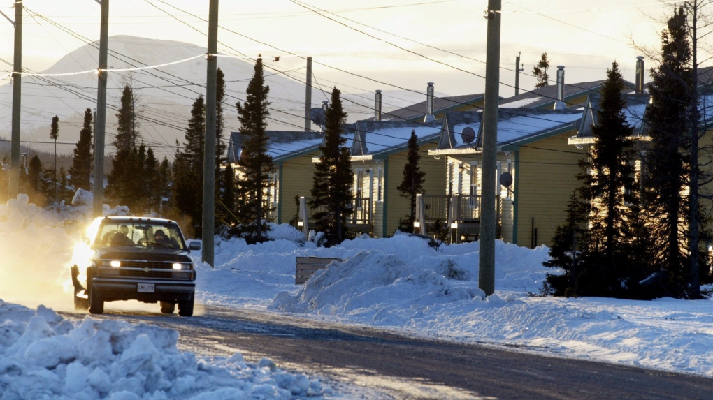 Innu residents of the Labrador community of Natuashish, N.L. head through town on Tuesday, Dec. 2, 2003. (CP PHOTO/Andrew Vaughan)