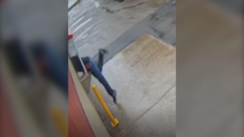 An image of the alleged suspect crawling through the drive-thru window. (Source: Charlottetown police) 
