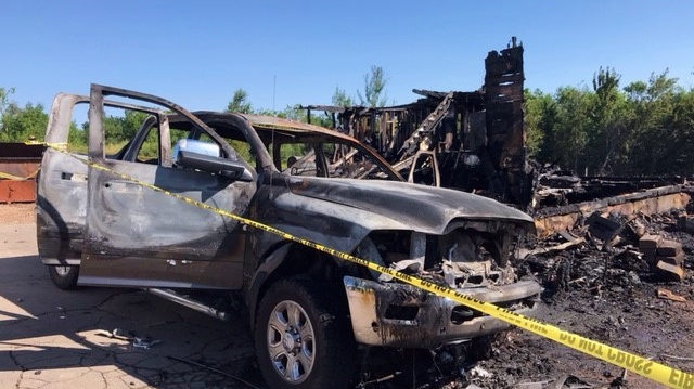 A burned-out truck is seen in front of the charred remnants of two buildings in Memramcook, N.B., on July 31, 2022, (CTV/Derek Haggett) 