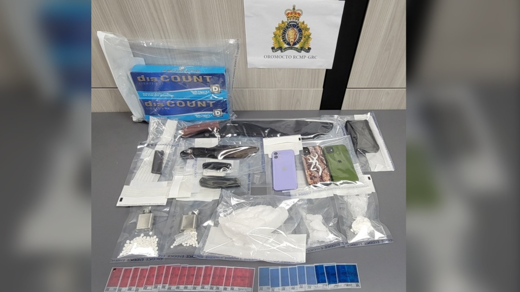 Police said they seized what is believed to be methamphetamine, cocaine, and hydromorphone pills, as well as contraband cigarettes. Police also seized weapons, ammunition, counterfeit vehicle inspection stickers, and drug trafficking paraphernalia. (PHOTO: RCMP)