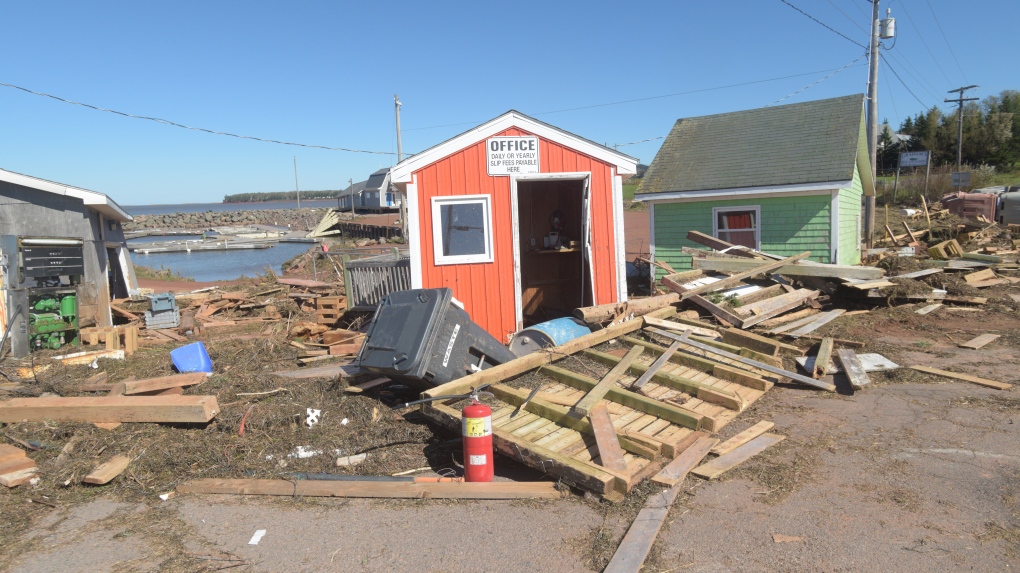 The wharf is damaged at Stanley Bridge, P.E.I. on Sunday, September 25, 2022. After hammering Atlantic Canada, post-tropical storm Fiona has moved inland in southeastern Quebec, with Environment Canada saying the storm will continue to weaken as it tracks across southeastern Labrador and over the Labrador Sea. (THE CANADIAN PRESS/Brian McInnis)