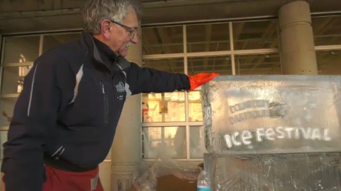 Richard Chaisson is finishing the final touches on an ice carving for the 2023 Downtown Dartmouth Ice Festival.