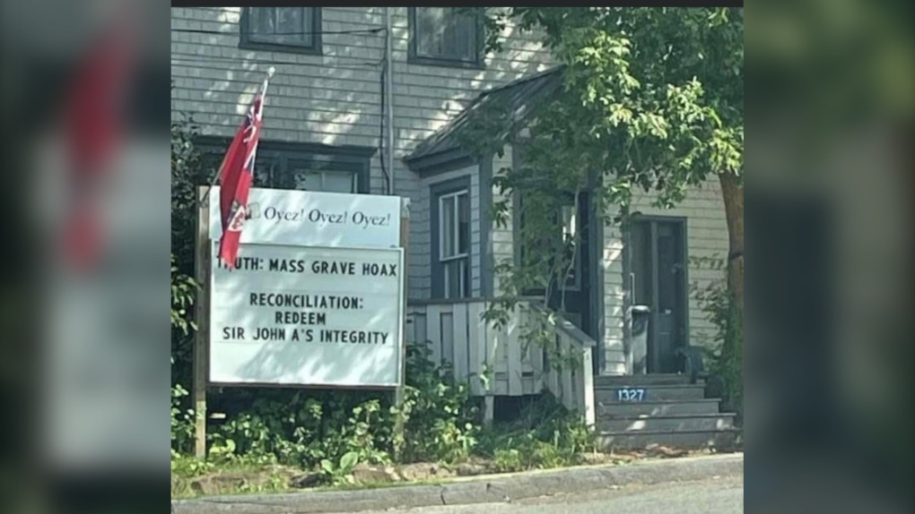 The sign posted by Councillor John Robertson, which is posted saying "Truth: Mass Graves Hoax, Reconciliation: Redeem Sir John A's Integrity." (Courtesy: Gregory Miller) 