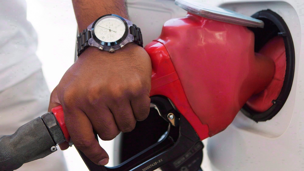 A person pumps fuel in Toronto after gasoline prices rose overnight on Wednesday, September 12, 2012. THE CANADIAN PRESS/Michelle Siu