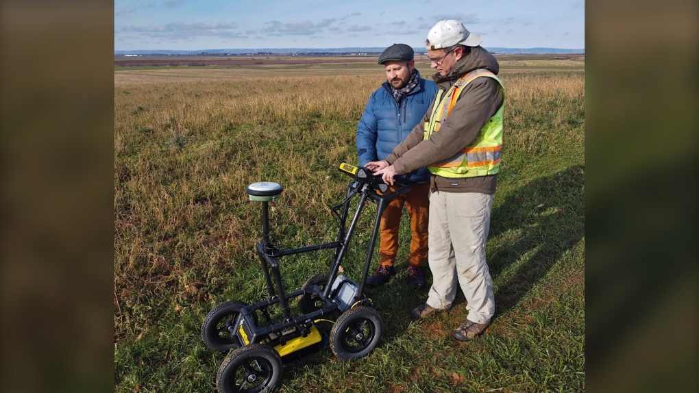 Saint Mary’s University professors Jonathan Fowler (right) and Aaron Taylor (left) work with ground penetrating radar in Grand-Pré, N.S., in December, 2022. A team from Saint Mary’s will work with the U.S. in France this summer in an attempt to find a missing crew member from a Second World War bomber. (THE CANADIAN PRESS/HO-Saint Mary’s University)