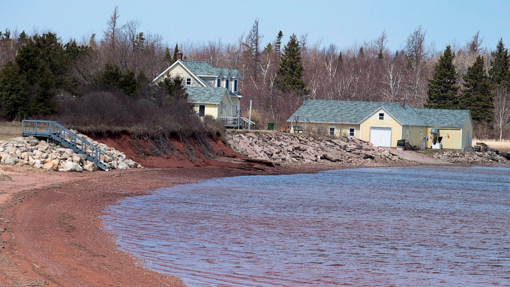 Residents use rock to reinforce the shore line in parts of Lennox Island, P.E.I. on Monday, April 25, 2016. (THE CANADIAN PRESS/Andrew Vaughan)