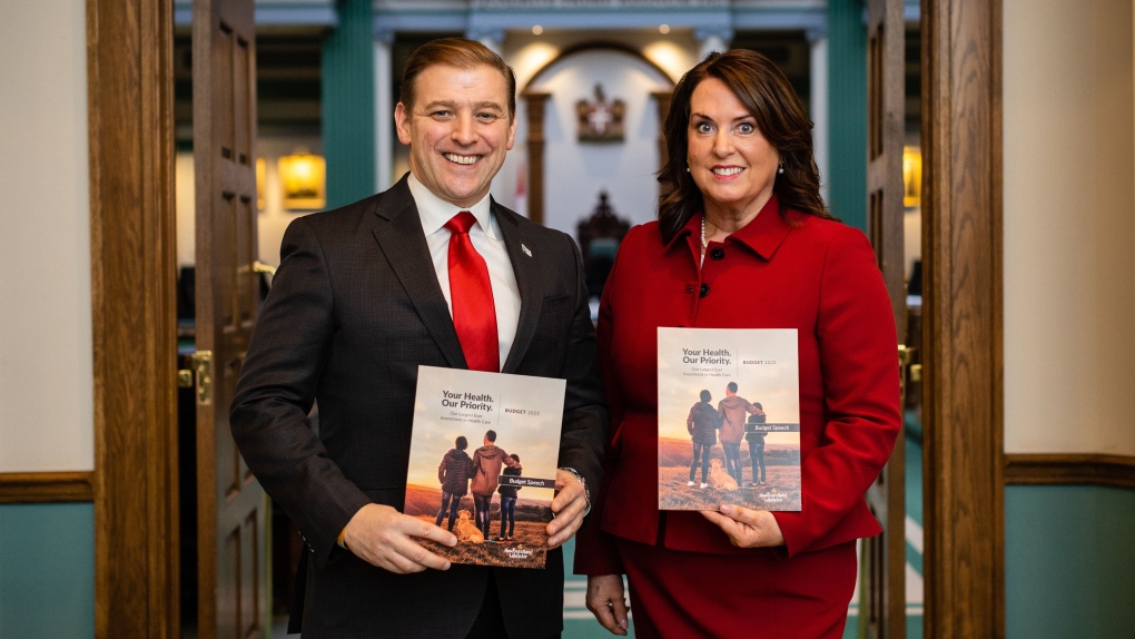 Newfoundland and Labrador Premier Andrew Fuery poses with Finance Minister Siobhan Coady pose with a copy of the 2023/2024 provincial budget. (Source: @FureyAndrew/Twitter) 