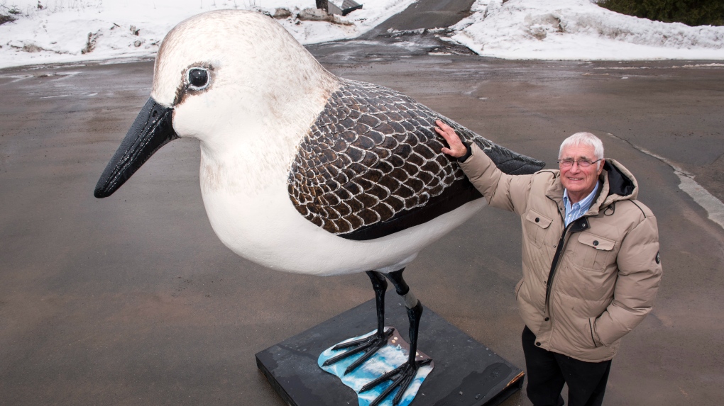 Robin Hanson stands with his statue of a semipalmated sandpiper outside of his gallery in French Lake, which is approximately 30 minutes south of Fredericton, New Brunswick on Friday March 24, 2023. THE CANADIAN PRESS/Stephen MacGillivray