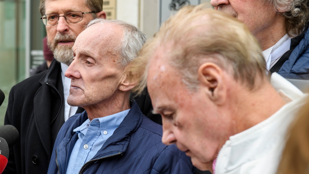 Robert Mailman, left, and Walter Gillespie, speak to media shortly after their hearing at Saint John Law Courts in Saint John, N.B., January 4, 2024. The two men recently had a 1984 murder conviction overturned and have now been found formally not guilty. THE CANADIAN PRESS/Michael Hawkins