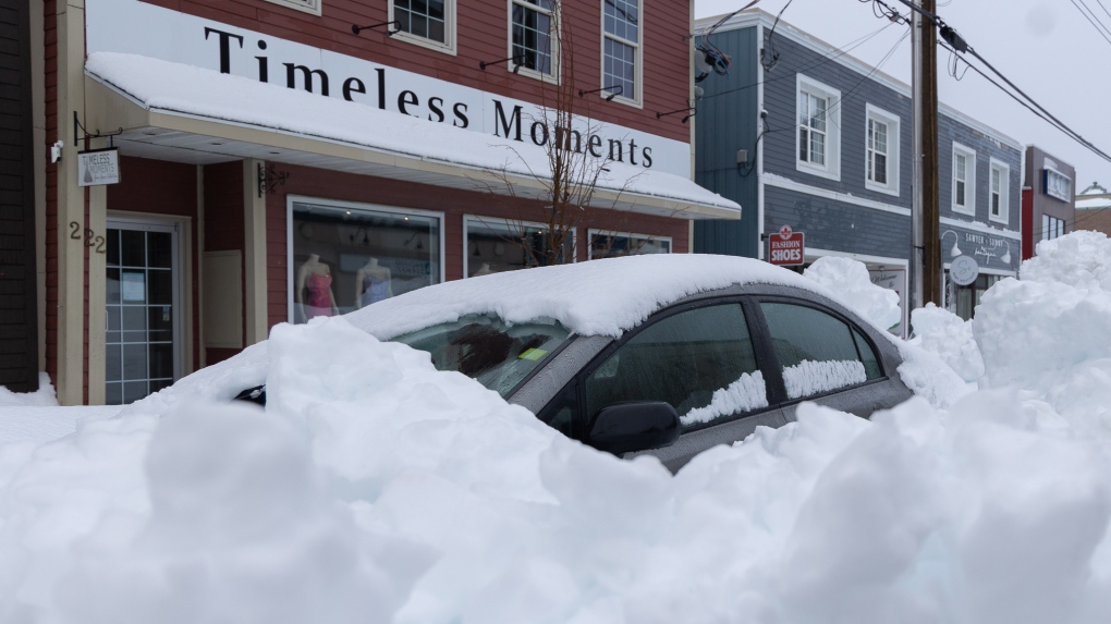 Vehicle buried after winter storm in Sydney, N.S. on Monday, Feb. 5, 2024. THE CANADIAN PRESS/Shane Wilkie